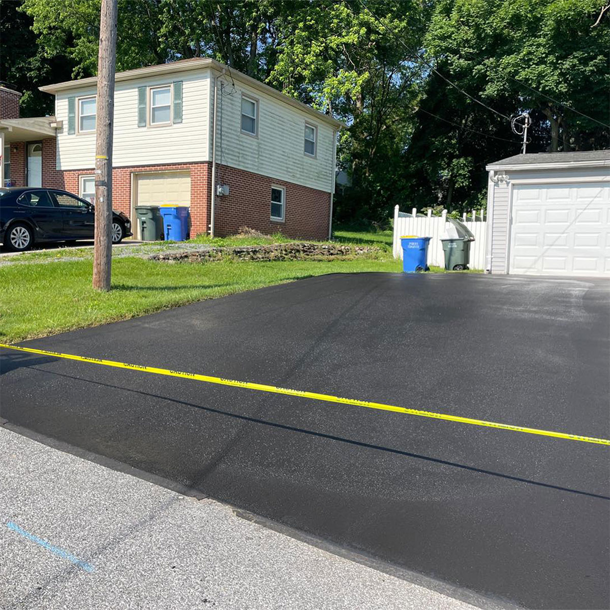 Freshly sealed driveway by Robert Stanley